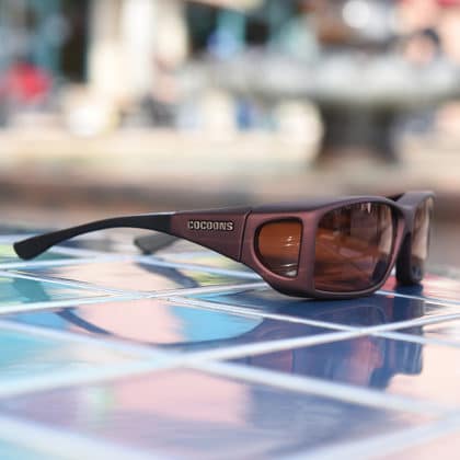 Burgundy fitover sunglasses with a copper lens system